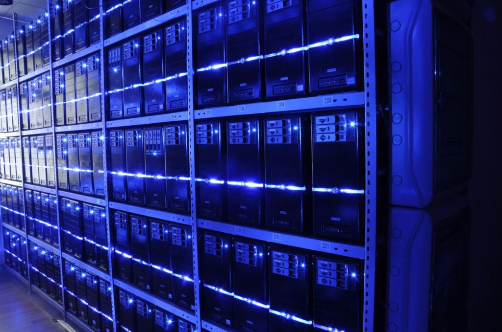 Data Centres Cool Servers With Recycled Water Systems Engineer monitoring servers in a data centre using recycled water cooling