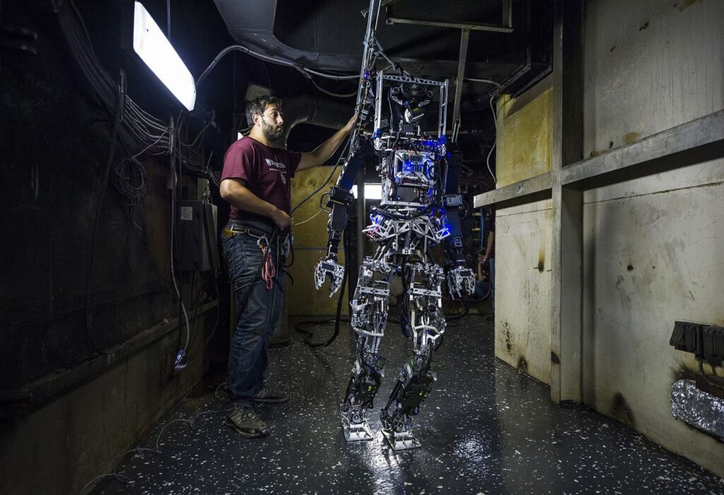 Humanoid robot practising careful hand movements in a laboratory