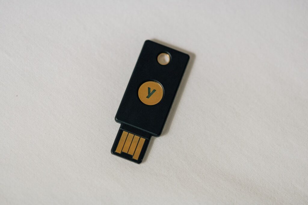 A person unlocking a smartphone with a fingerprint sensor