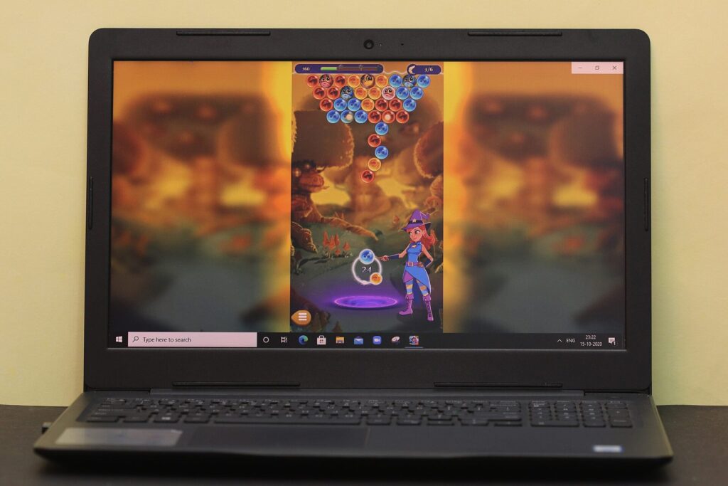 A laptop screen displaying a colourful online puzzle game
